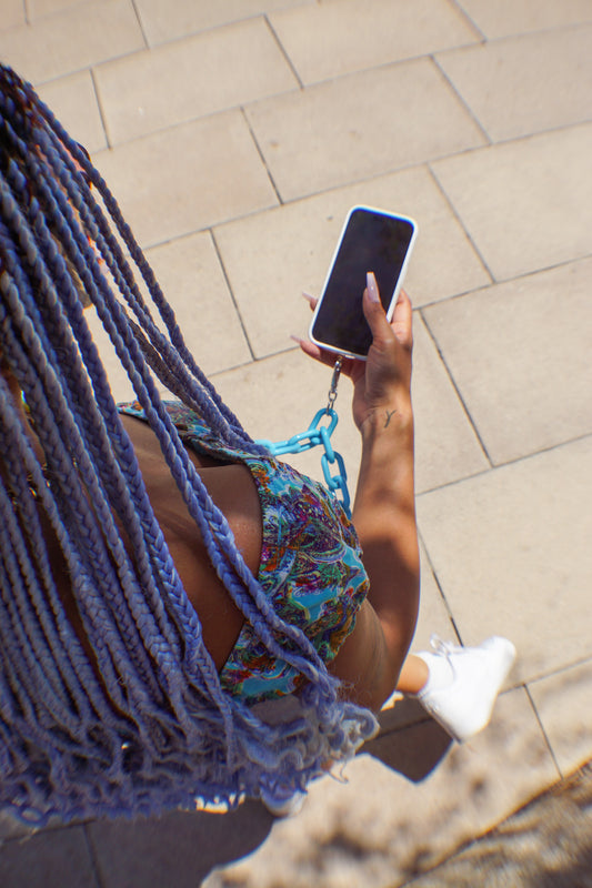 girl with phone strap accessory